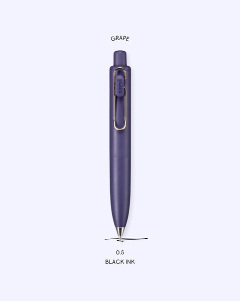 A picture of the Uniball One P Ballpoint Pen in the color Grape, with text that explains that the nib size is 0.5 and the ink color is black