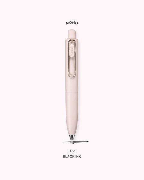 A picture of the Uniball One P Ballpoint Pen in the color Momo, with text that explains that the nib size is 0.38 and the ink color is black