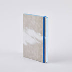 nuuna Clouds Junk Journal — grey softcover with a white cloud print and blue elastic closure