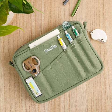 Soolla Studio Pouch in Ganja Green — green canvas pouch lifestyle view