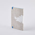 Back of the nuuna Clouds Junk Journal, grey cloud-print cover with blue elastic and light-blue page edges