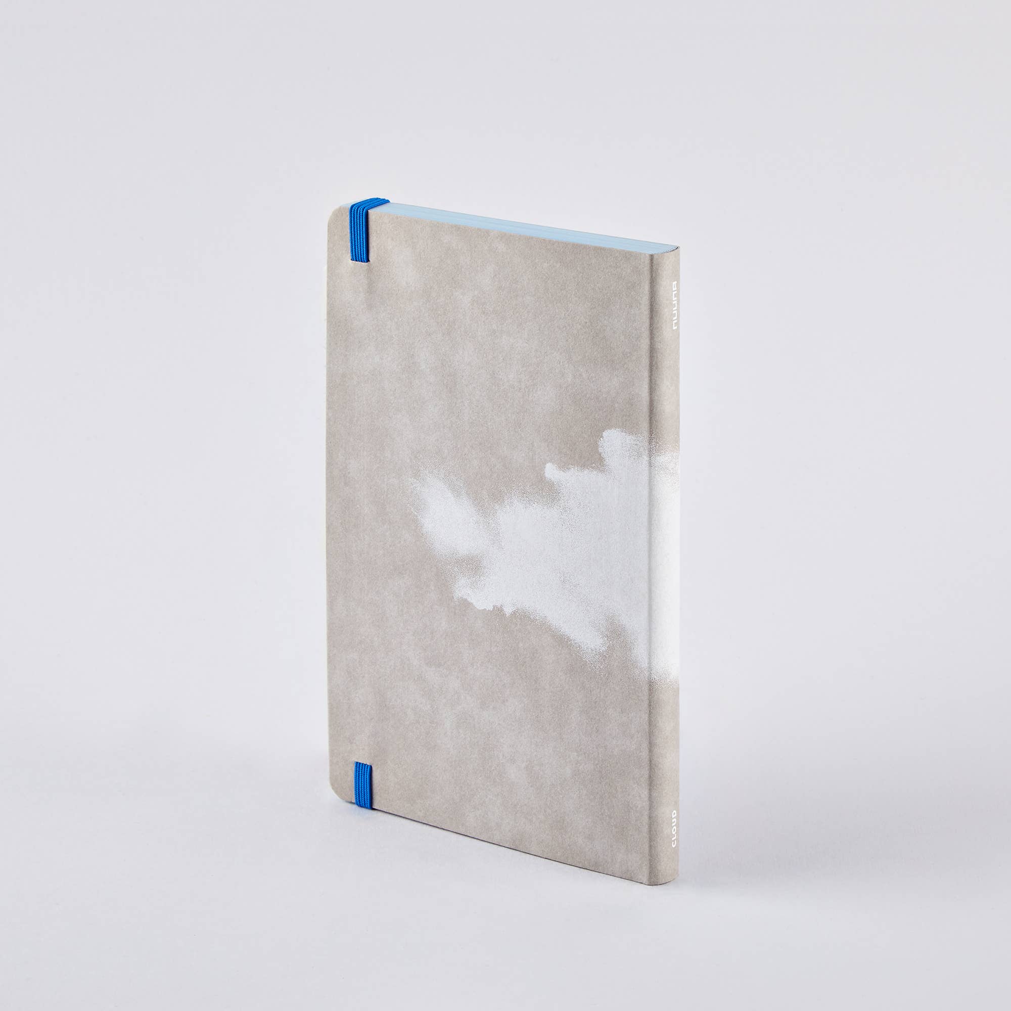Back of the nuuna Clouds Junk Journal, grey cloud-print cover with blue elastic and light-blue page edges