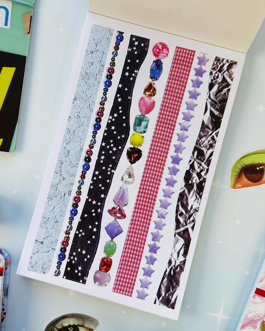 Open page of the junk journal sticker book with decorative border strips — lace, stars, red gingham, gemstones and foil