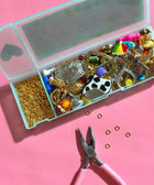 Assorted vintage charms and jewelry findings from Haricot Vert Mystery Bundle for journal decoration and craft projects