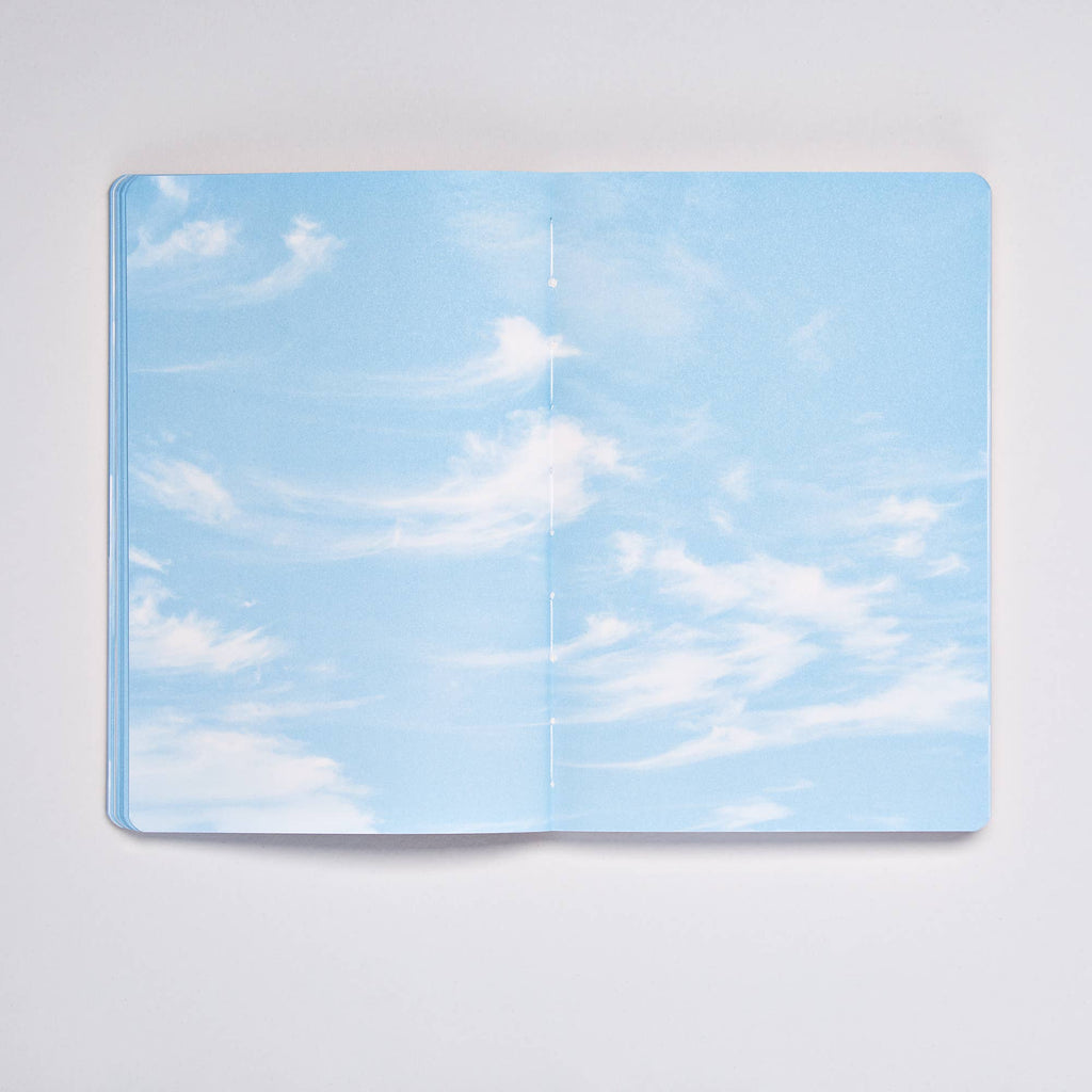 Open Clouds Junk Journal spread with a pale blue sky and wispy cirrus clouds