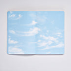Open Clouds Junk Journal spread with a pale blue sky and wispy cirrus clouds