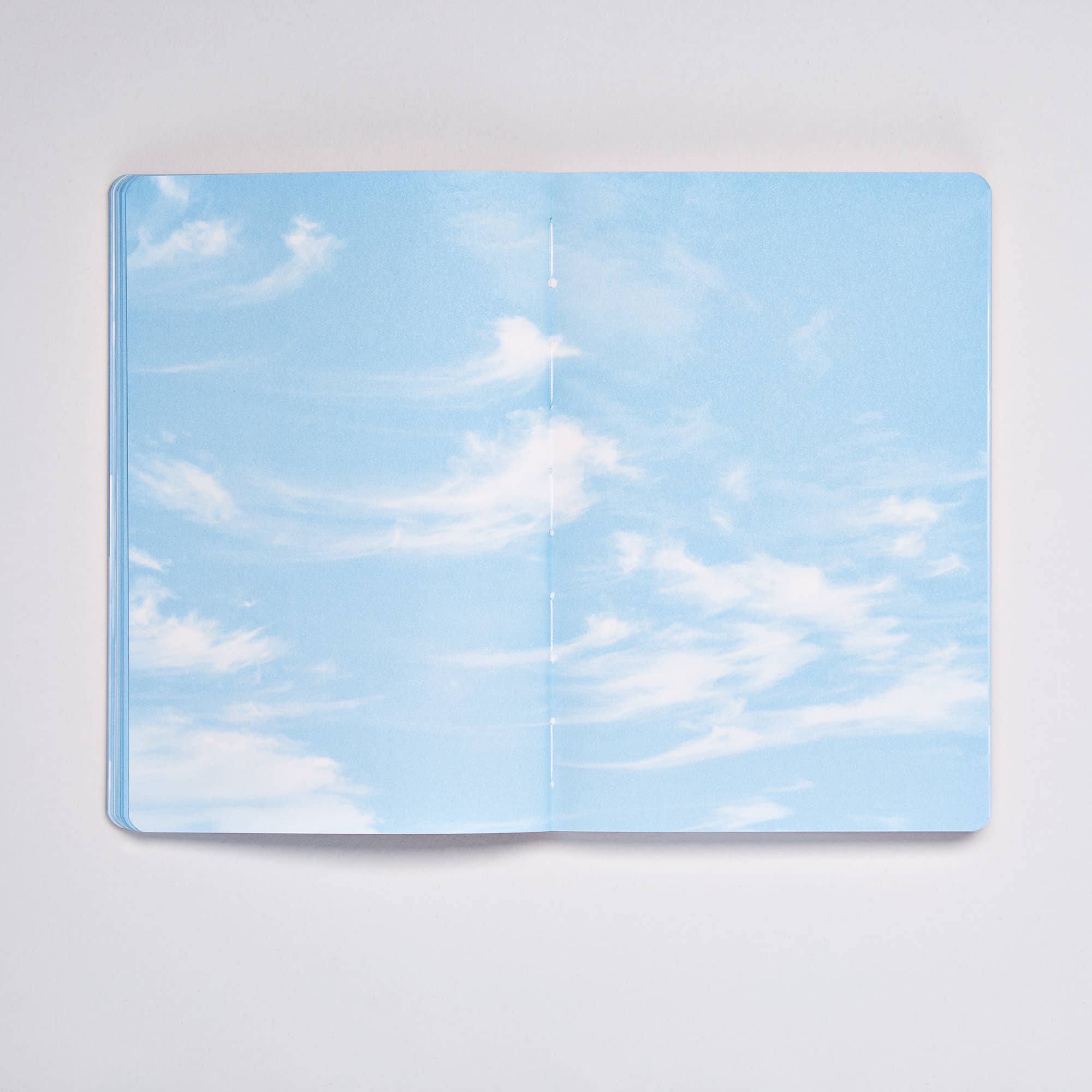 Open Clouds Junk Journal spread with a pale blue sky and wispy cirrus clouds